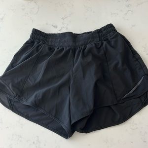Black hotty hot lululemon shorts. Low-rise 4 inch. Lined. Size 6